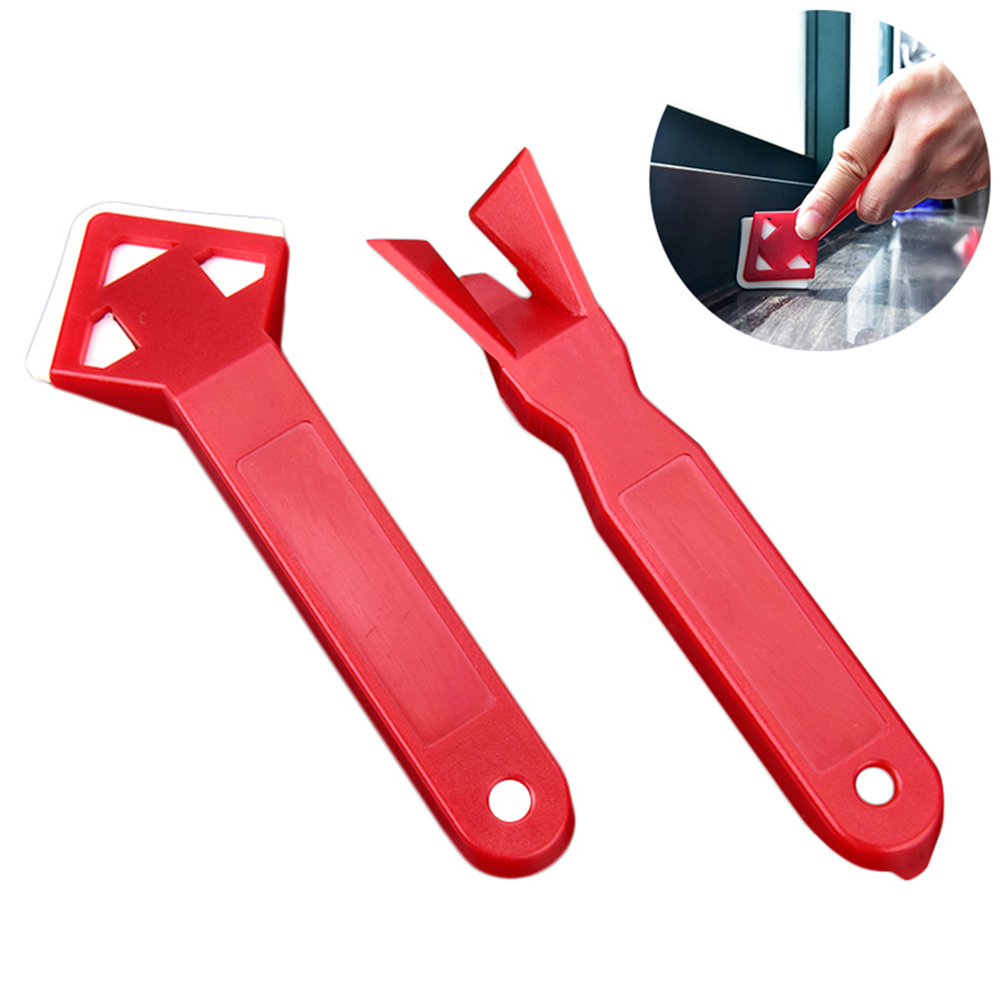 Ein Set Aus Zwei Werkzeugen Zum Entfernen Von Klebstoffresten, Bestehend Aus Einem Fugenschaber, Einem Silikondichtstoffschaber Und Einem Fugenreinigungswerkzeug.
