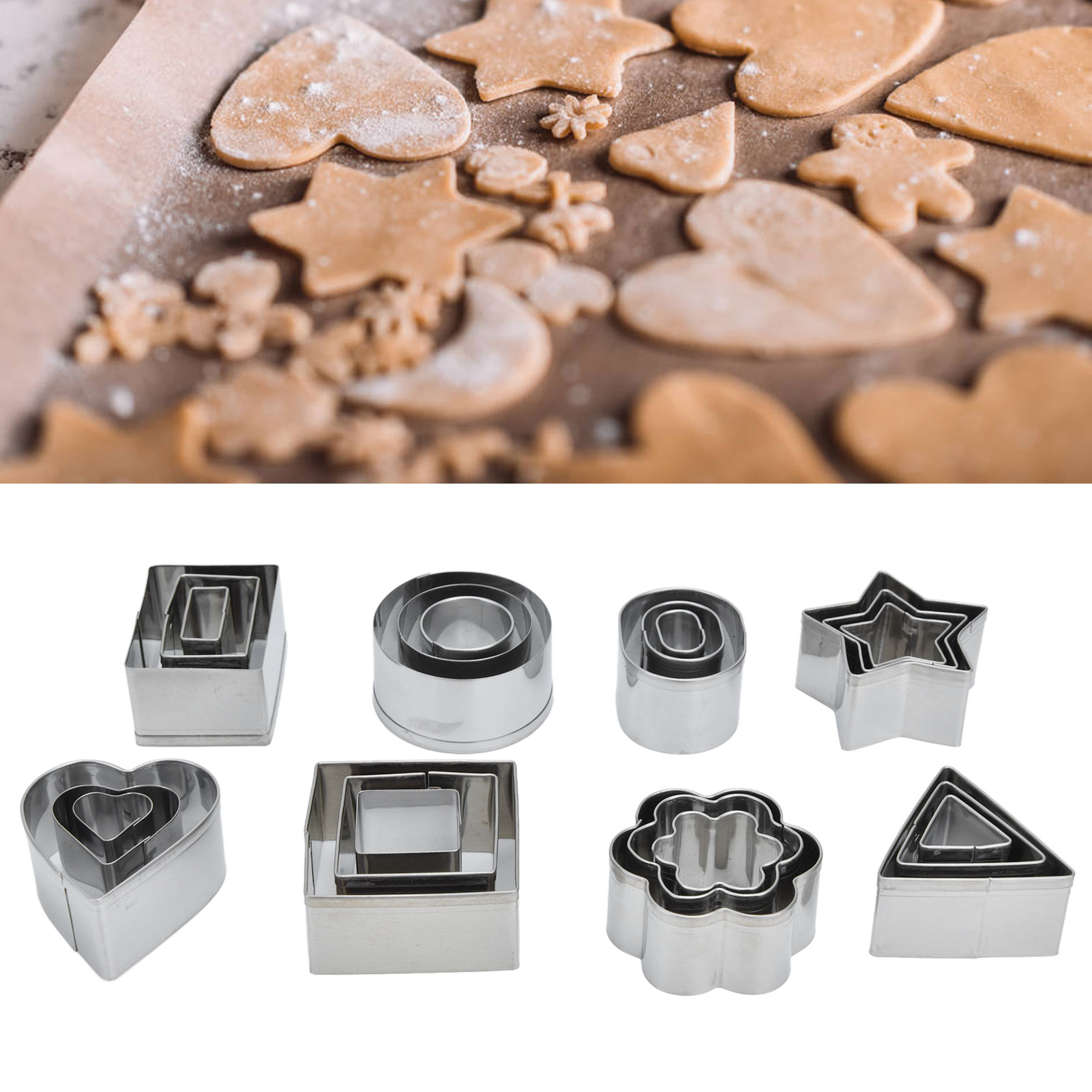 Set Mit 24 Ausstechformen Aus Edelstahl, Darunter Pralinenformen, Keksausstecher Und Grafische Ausstecher, In Einer Rechteckigen Weißen Schachtel.