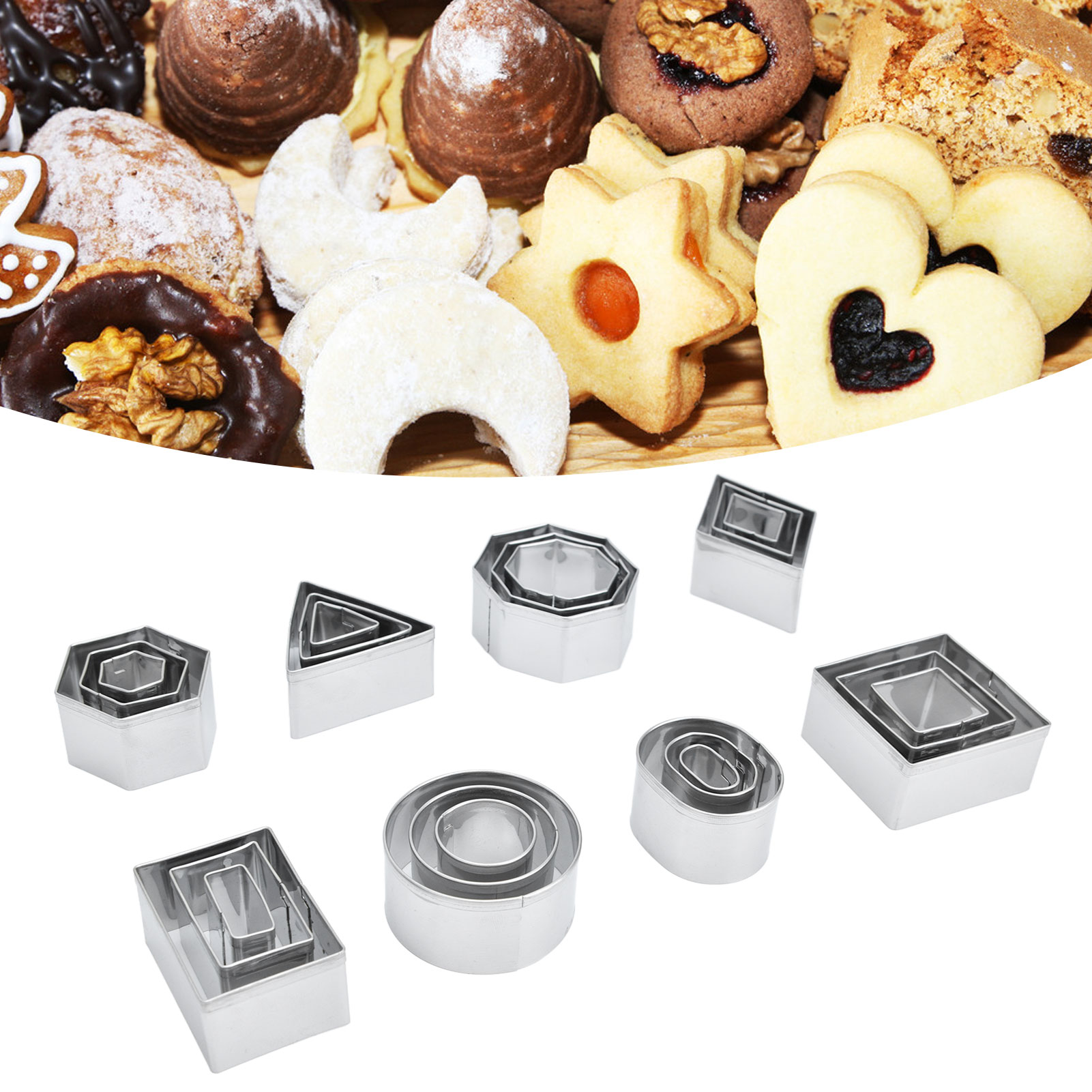 Set Mit 24 Ausstechformen Aus Edelstahl, Darunter Pralinenformen, Keksausstecher Und Grafische Ausstecher, In Weißen Achteckigen Schachteln.