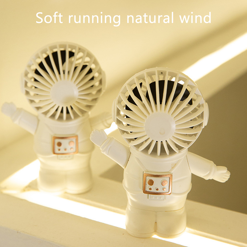 Ein Kleiner Tragbarer Ventilator In Form Eines Handgezeichneten Astronauten, Weiß, Wie Abgebildet.