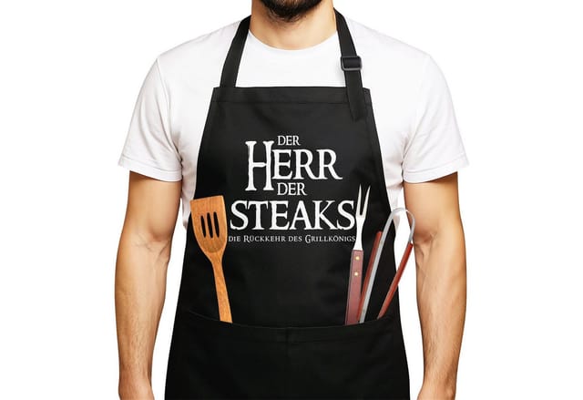 MoonWorks Grillschürze Grill-Schürze für Männer mit Spruch Der Herr der Steaks die Rückkehr, mit kreativem Aufdruck
