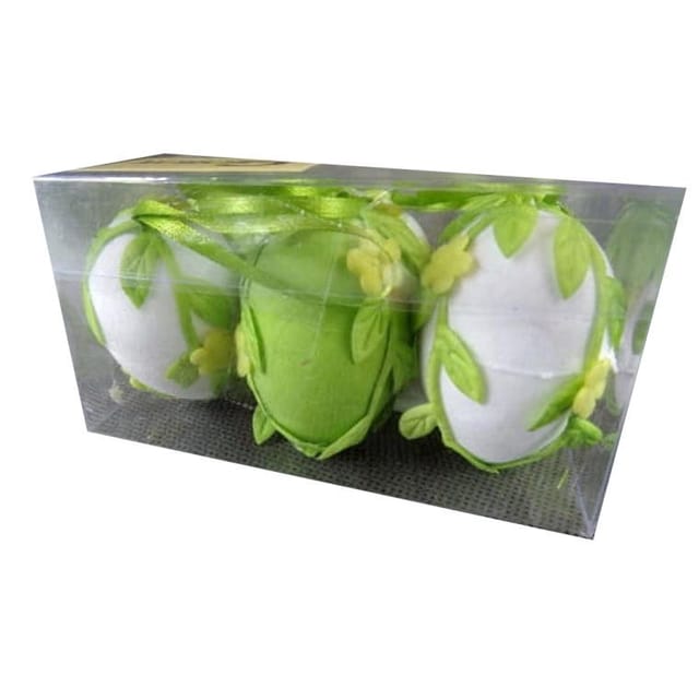 Ein Set Aus 6 Eiern, Auf Die Grüne Stoffblumen Und Blätter Geklebt Sind.