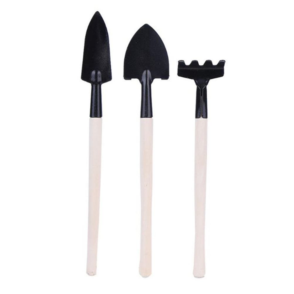 Set Aus 3 Mini-gartengeräten: Schaufel, Spaten, Rechen Und Pflanzkelle Mit Holzgriff.