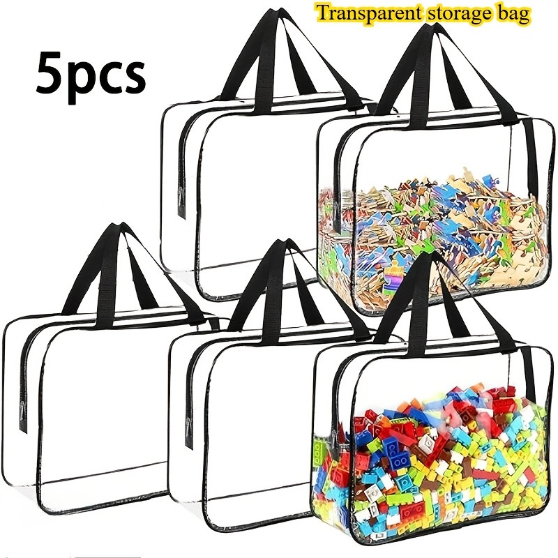 Fünf Transparente Aufbewahrungsbeutel Aus Pvc (30 × 18 × 10 Cm) Mit Reißverschluss Und Tragegriffen. Diese Vielseitigen, Transparenten Reisebeutel Eignen Sich Zur Aufbewahrung Von Kleidung Und Toilett
