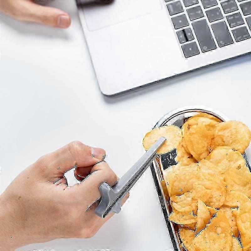 Set Aus 3 Finger-essstäbchen Zum Snacken, Ein Spielzeug Und Ein Zubehör Zum Greifen Von Speisen
