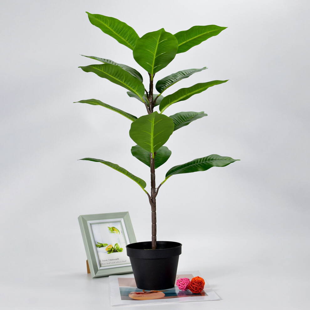 Ein Set Aus Künstlichen Bananenstauden, Tropischen Monstera-blättern, Künstlichen Schildkröten, Großen Palmenblättern, Farnen Und Künstlichen Grünpflanzen Und Sträuchern Zur Dekoration.
