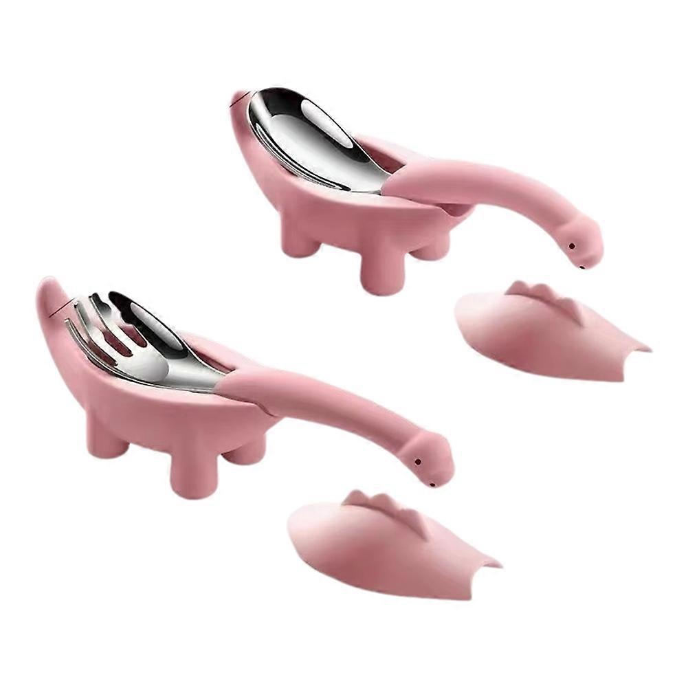 Babybesteck-set Aus Rosafarbenem Edelstahl, Bestehend Aus Einem Löffel Und Einer Gabel In Dinosaurierform. Design: Cartoon.